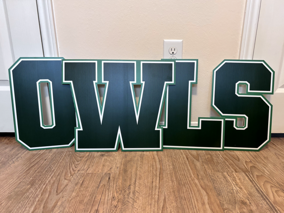 Cut letter OWLS signs inside