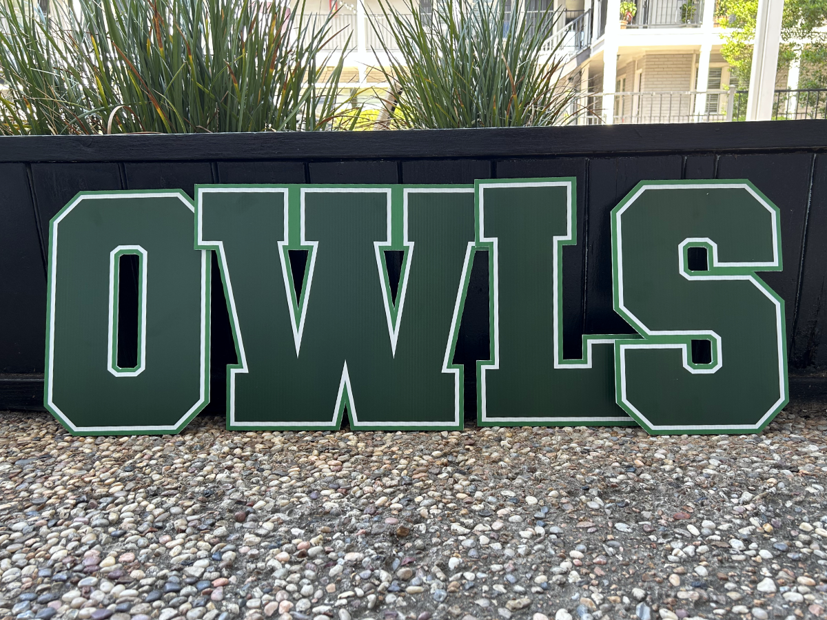 Cut letter OWLS signs outside